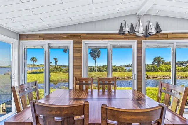 a large kitchen with stainless steel appliances granite countertop a sink stove and refrigerator