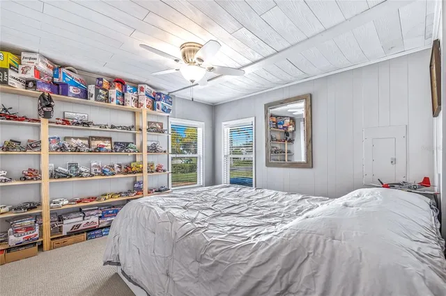 a bathroom with a granite countertop sink a toilet and a shower