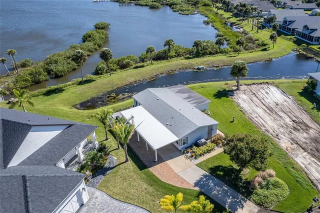 a view of a swimming pool with a yard