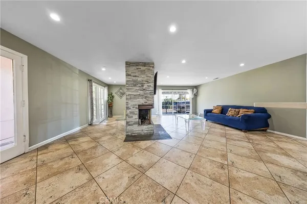 a view of a hallway with furniture and front door
