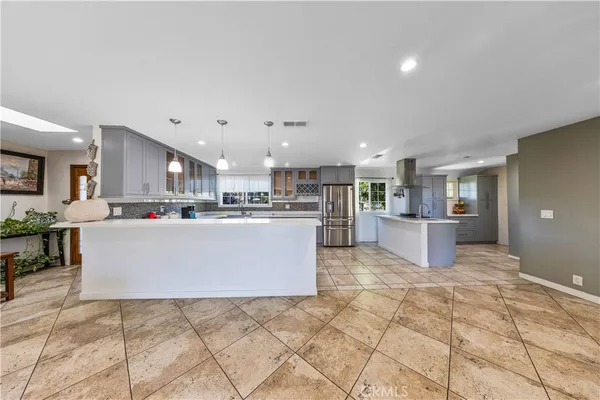 a kitchen with a stove and a sink