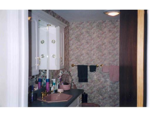 10 Indian Point Road Webster, MA 01570 - Photo 5 of 5 a picture of a bathroom with a sink and a mirror