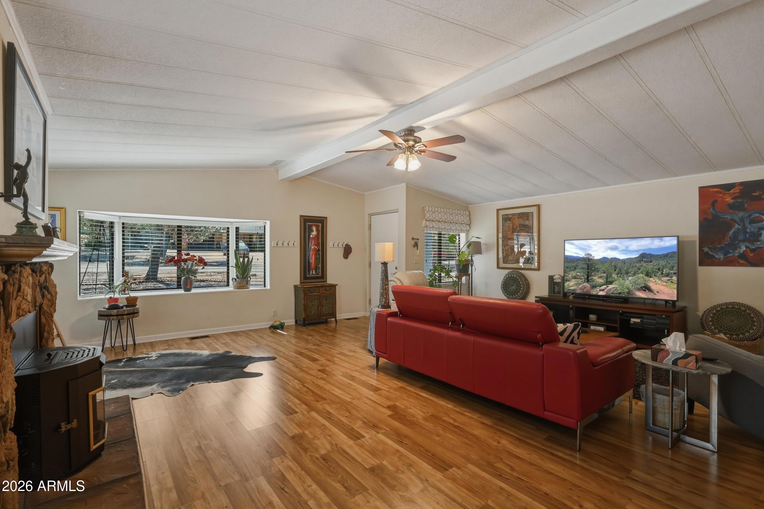 1108 North William Tell Circle Payson, AZ 85541 - Photo 21 of 32 a living room with furniture and a flat screen tv