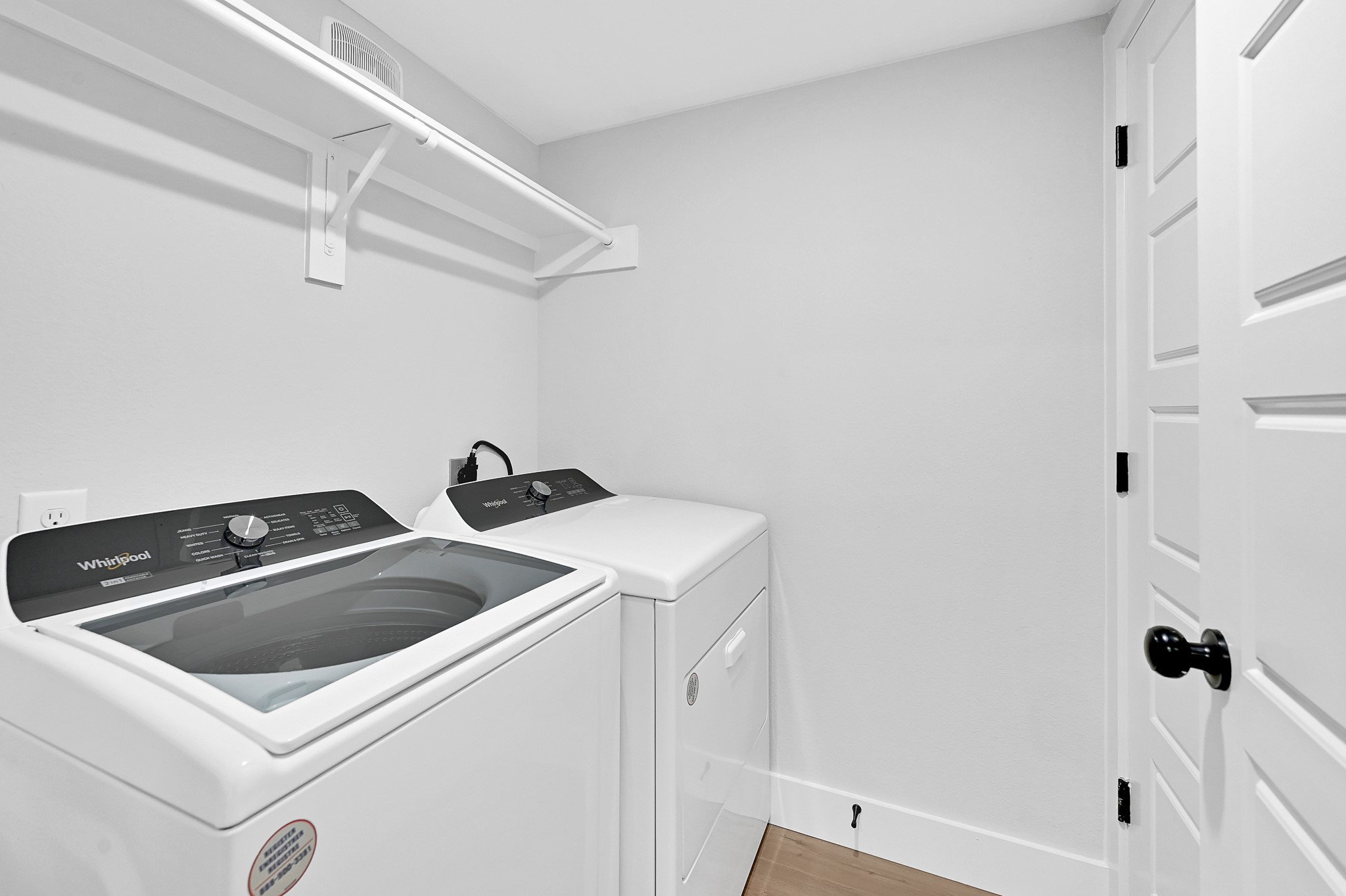 3312 Bacchus Street, Unit A Houston, TX 77022 - Photo 13 of 23 In home utility room with Whirlpool washer and dyer.