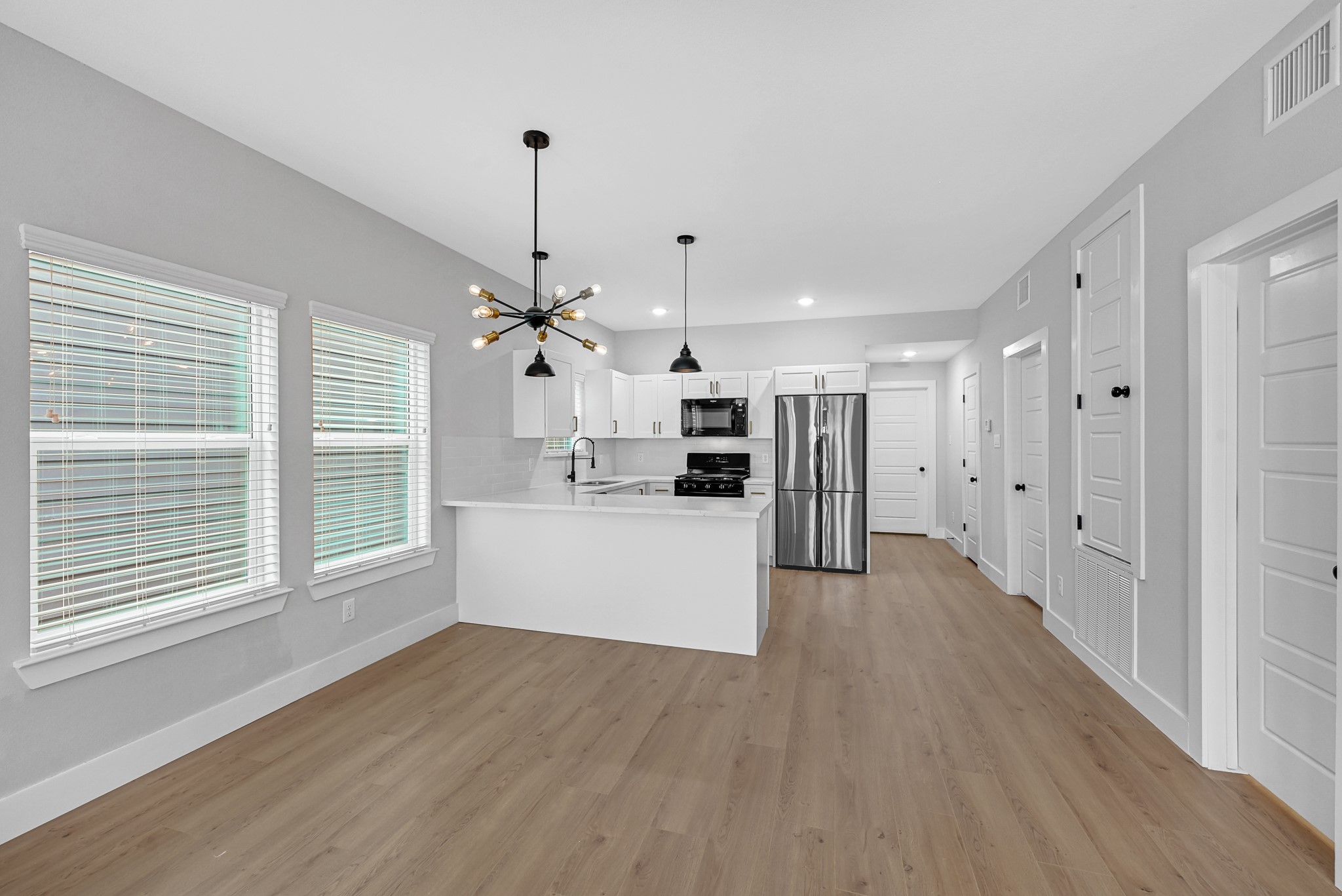 3312 Bacchus Street, Unit A Houston, TX 77022 - Photo 8 of 23 Spacious open living and dining space.