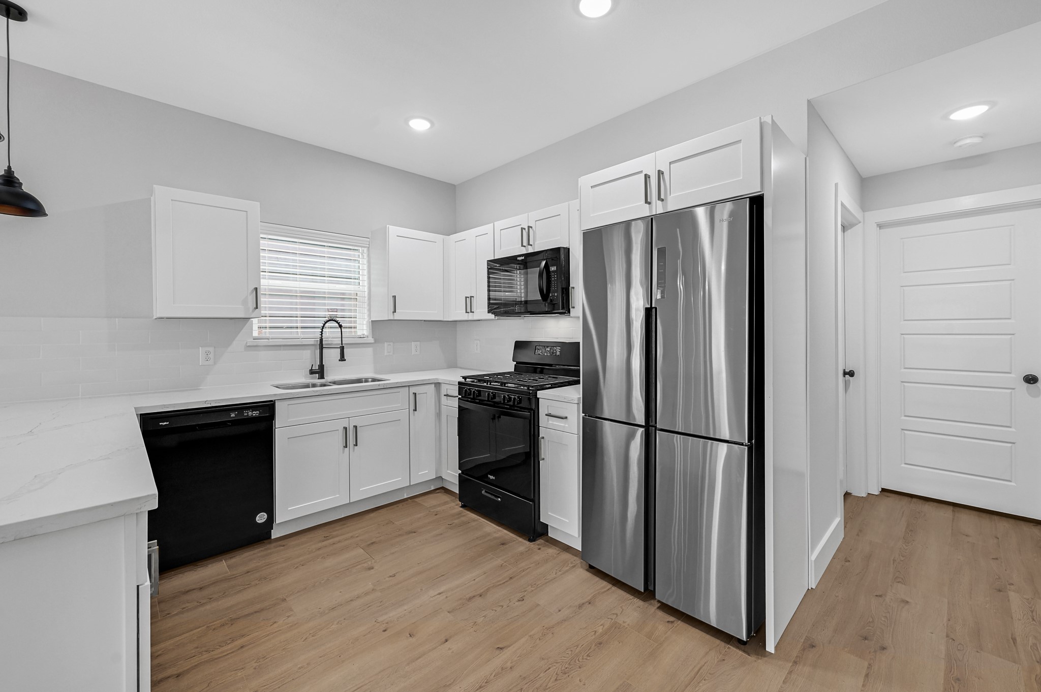 3312 Bacchus Street, Unit A Houston, TX 77022 - Photo 10 of 23 Open concept kitchen. with stainless steel appliances.