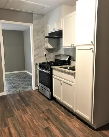 a kitchen with a stove and a refrigerator