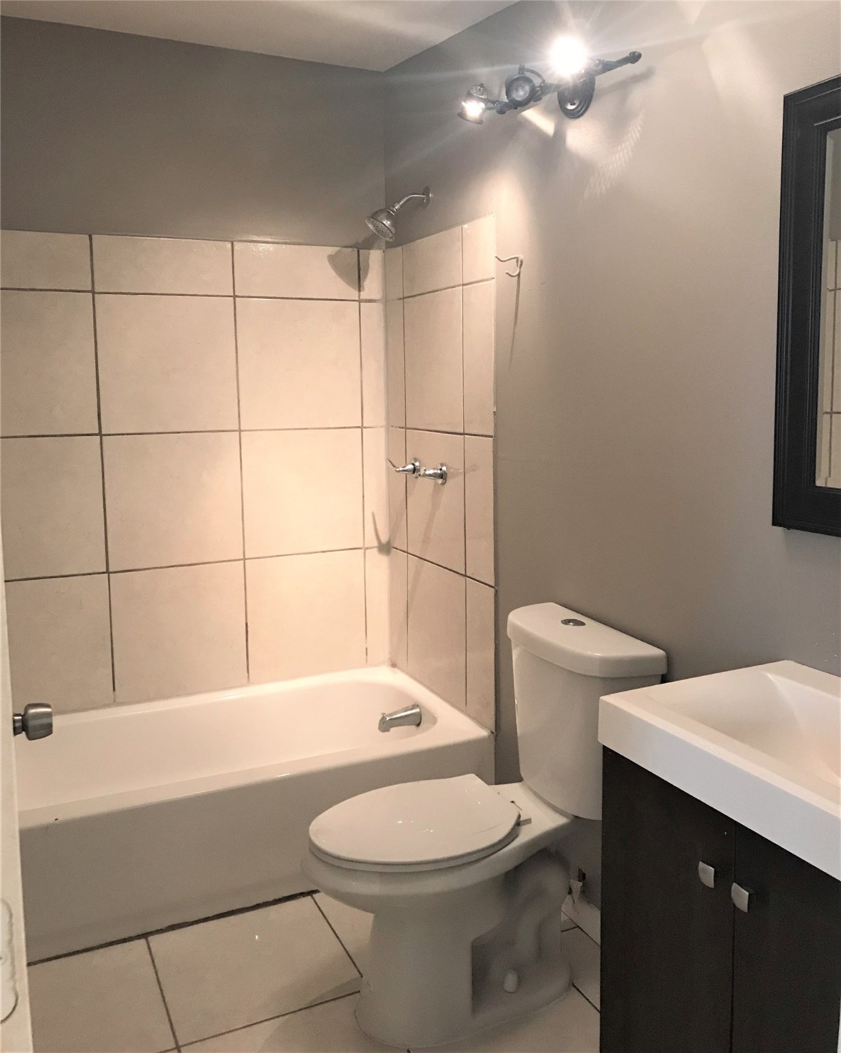 7314 Werner Street Houston, TX 77076 - Photo 7 of 9 a bathroom with a sink a toilet and shower