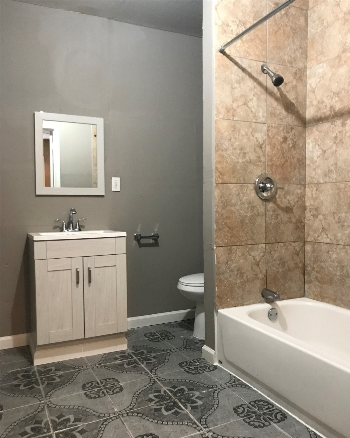 7314 Werner Street Houston, TX 77076 - Photo 9 of 9 a bathroom with a sink a toilet a mirror and bathtub