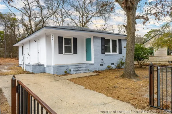 a view of house with yard