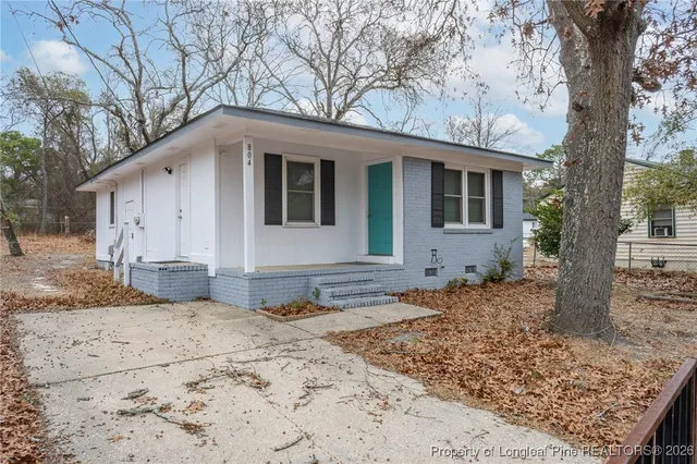 a view of a yard with a tree