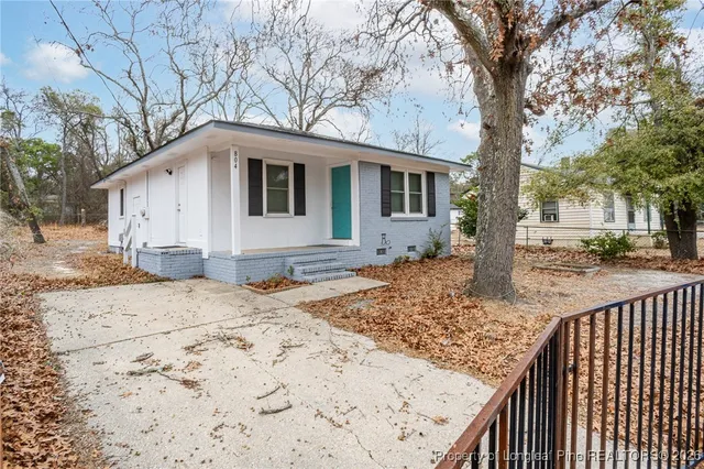 a house with trees in front of it