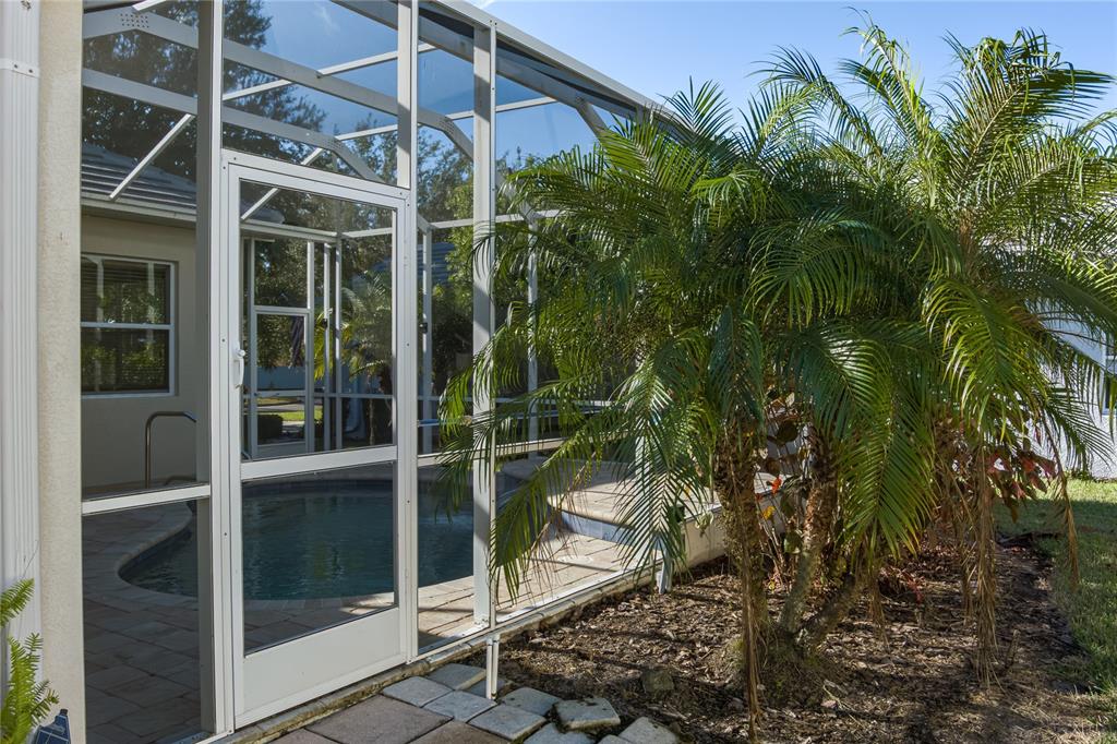 12150 Mapleridge Drive Parrish, FL 34219 - Photo 19 of 38 a view of a door with a tree