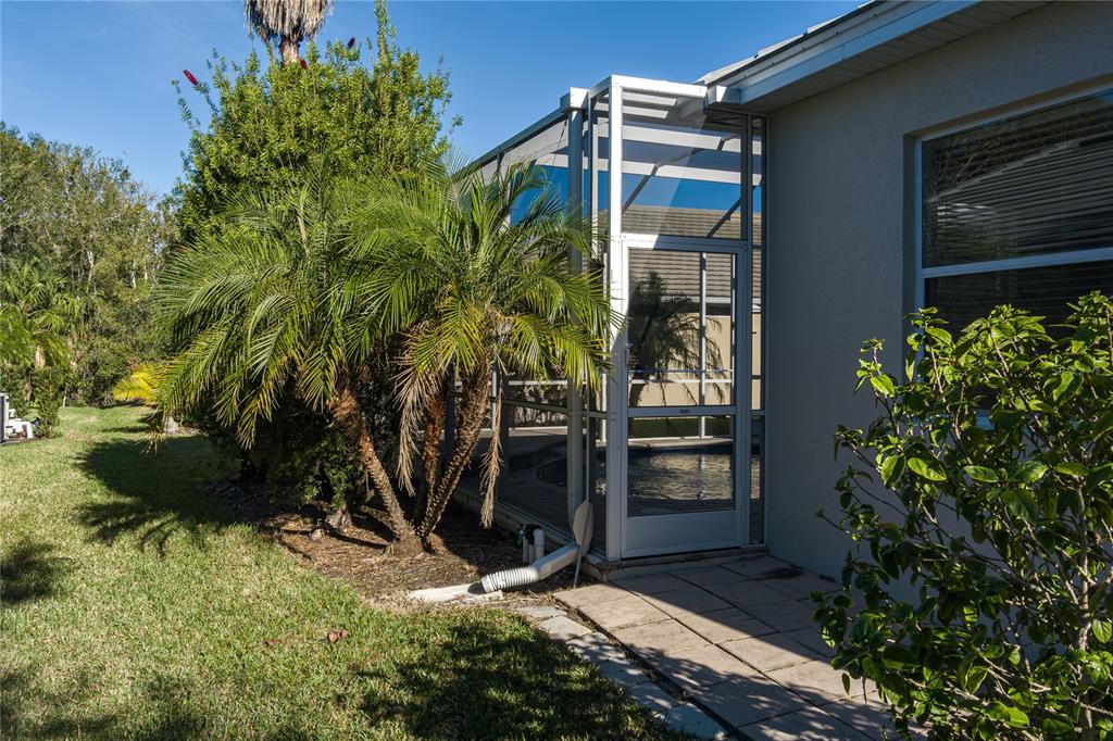 12150 Mapleridge Drive Parrish, FL 34219 - Photo 21 of 38 a view of a house with a yard