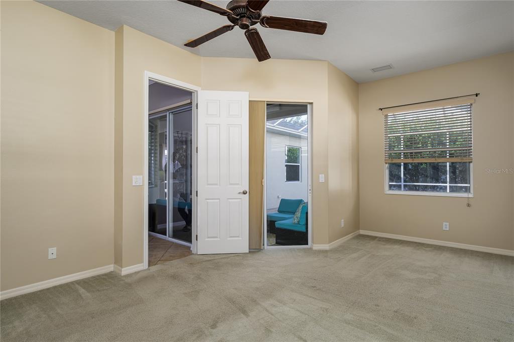 12150 Mapleridge Drive Parrish, FL 34219 - Photo 22 of 38 an empty room with windows and closet