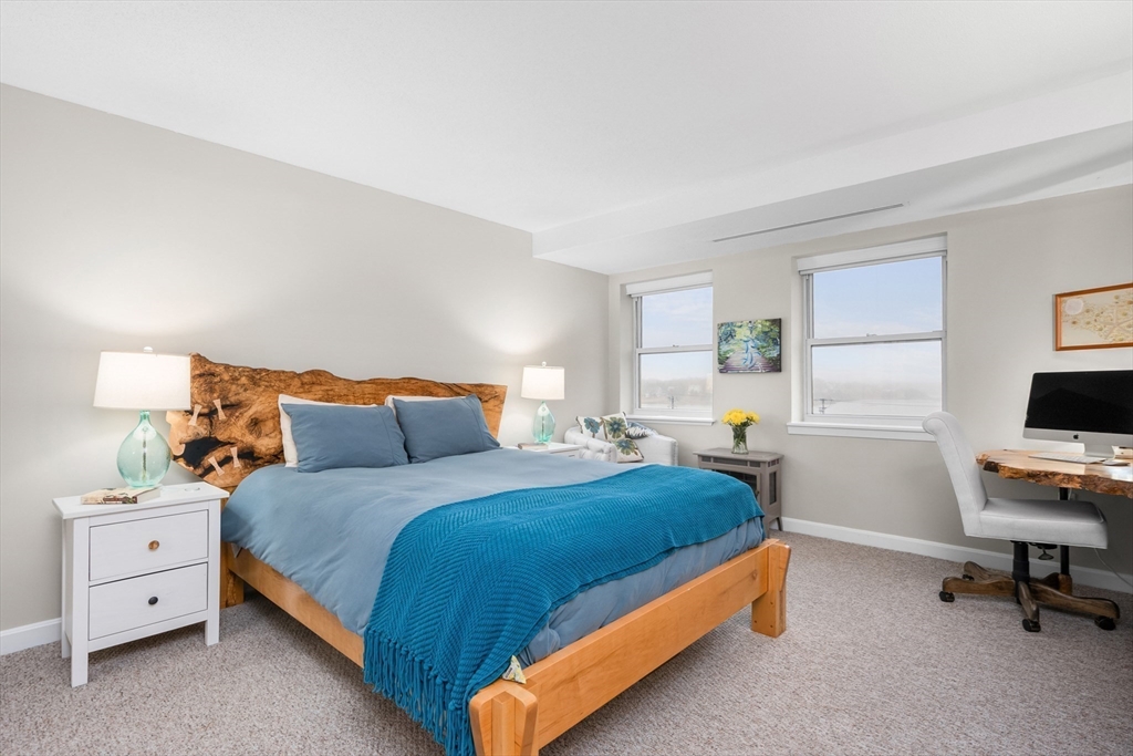 9 Park Hull Ma, Unit 505 Hull, MA 02045 - Photo 17 of 25 a bedroom with double bed and a tv on the dresser