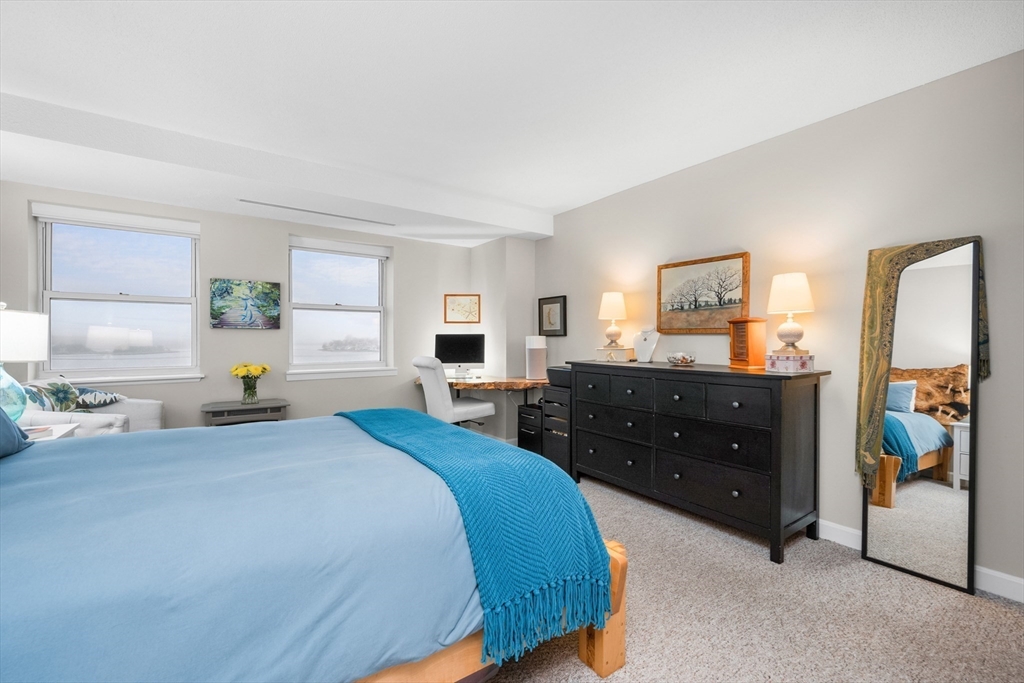 9 Park Hull Ma, Unit 505 Hull, MA 02045 - Photo 18 of 25 a bedroom with a bed and a dresser