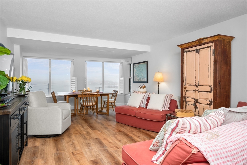 9 Park Hull Ma, Unit 505 Hull, MA 02045 - Photo 7 of 25 a living room with furniture and a large window