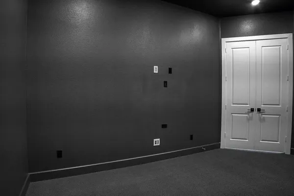 a bed room with a bed and a chandelier