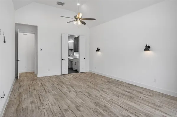 a bedroom with a bed and cabinet