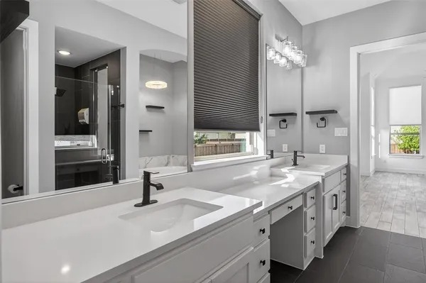 a bathroom with a tub and shower