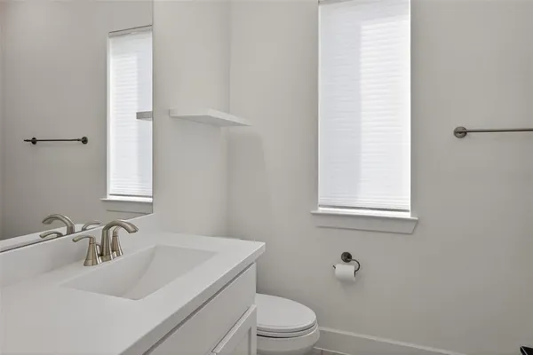 a bedroom with furniture and baby crib