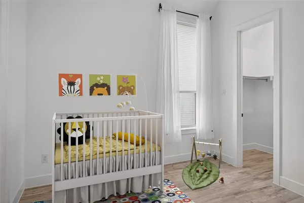 a bedroom with furniture and a window