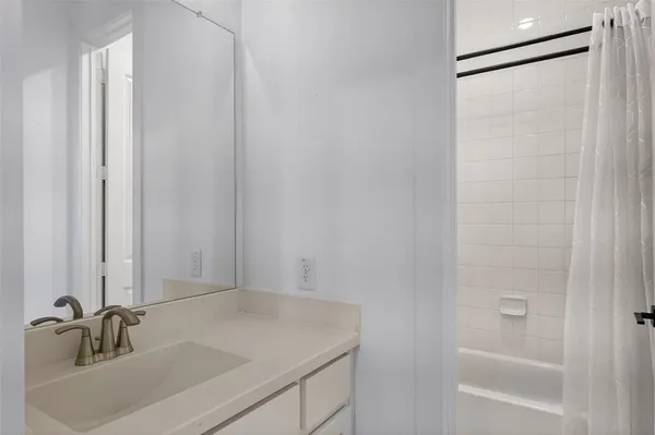 a bedroom with bed and a window