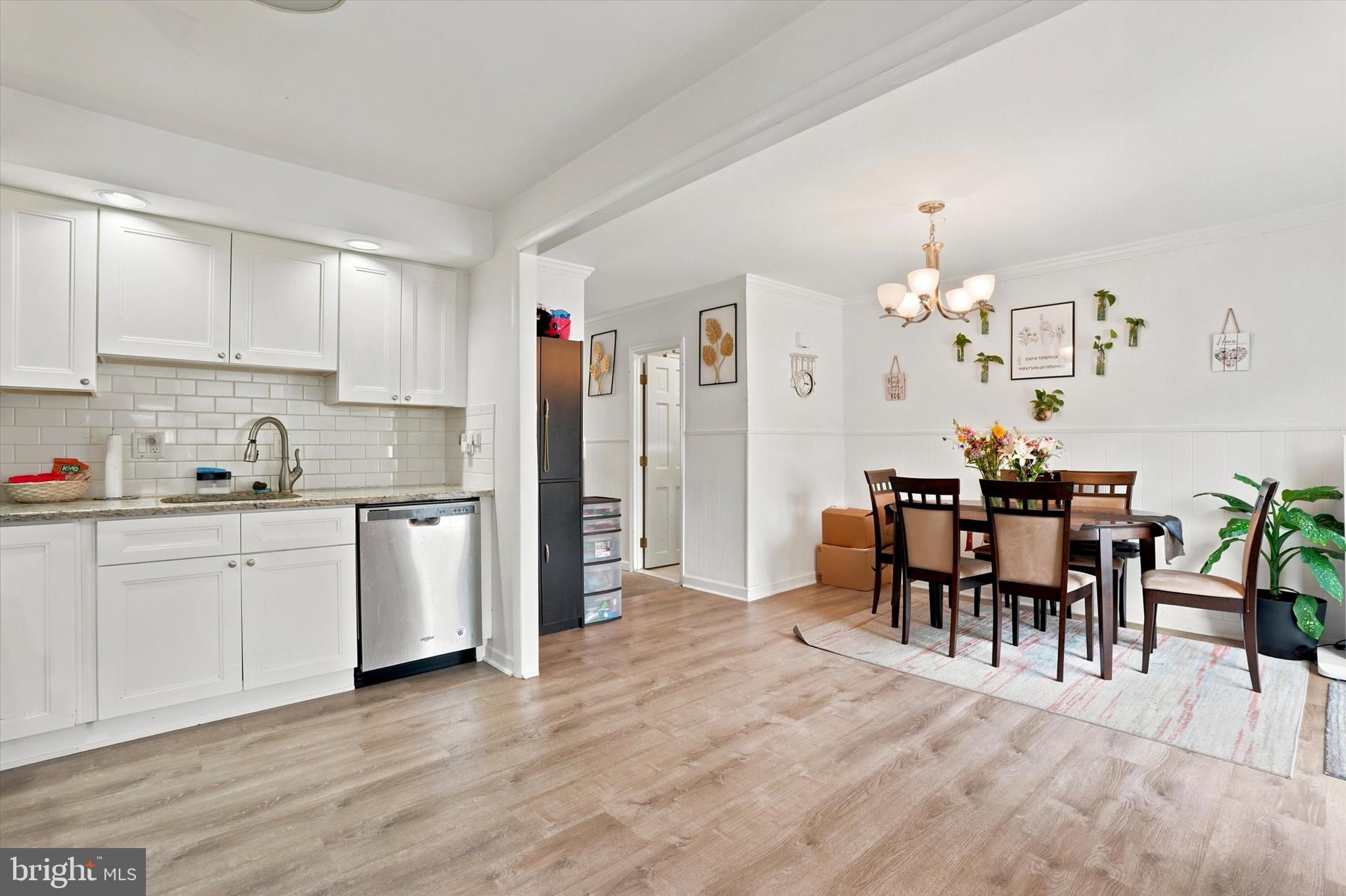 3435 Vinton Road Philadelphia, PA 19154 - Photo 11 of 25 a kitchen with granite countertop cabinets table and chairs