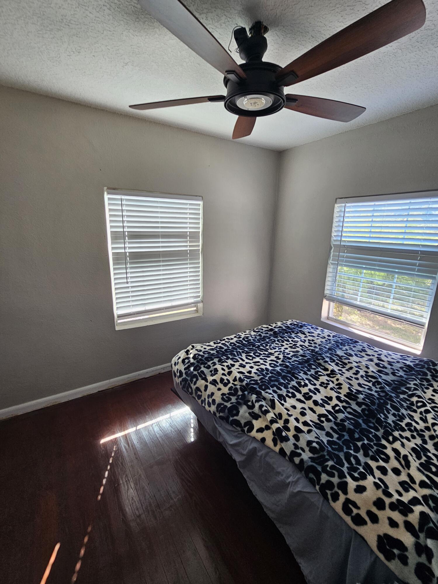 4900 Northwest 160th Street Okeechobee, FL 34972 - Photo 14 of 23 a bedroom with a bed and a window