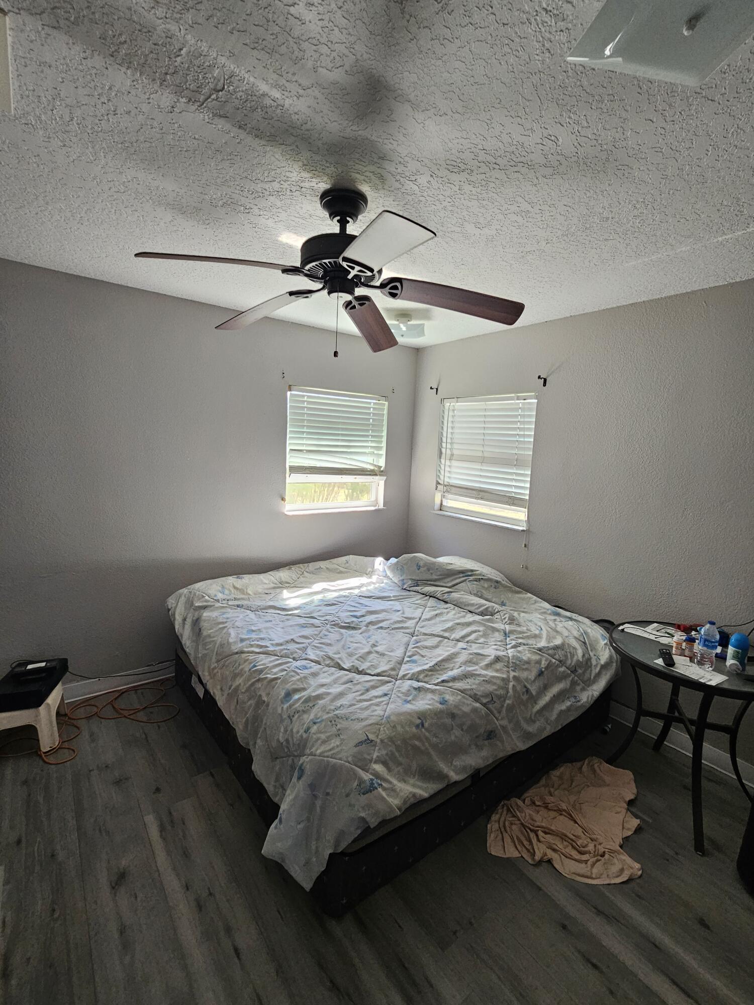 4900 Northwest 160th Street Okeechobee, FL 34972 - Photo 15 of 23 a bed sitting in a bedroom next to a window