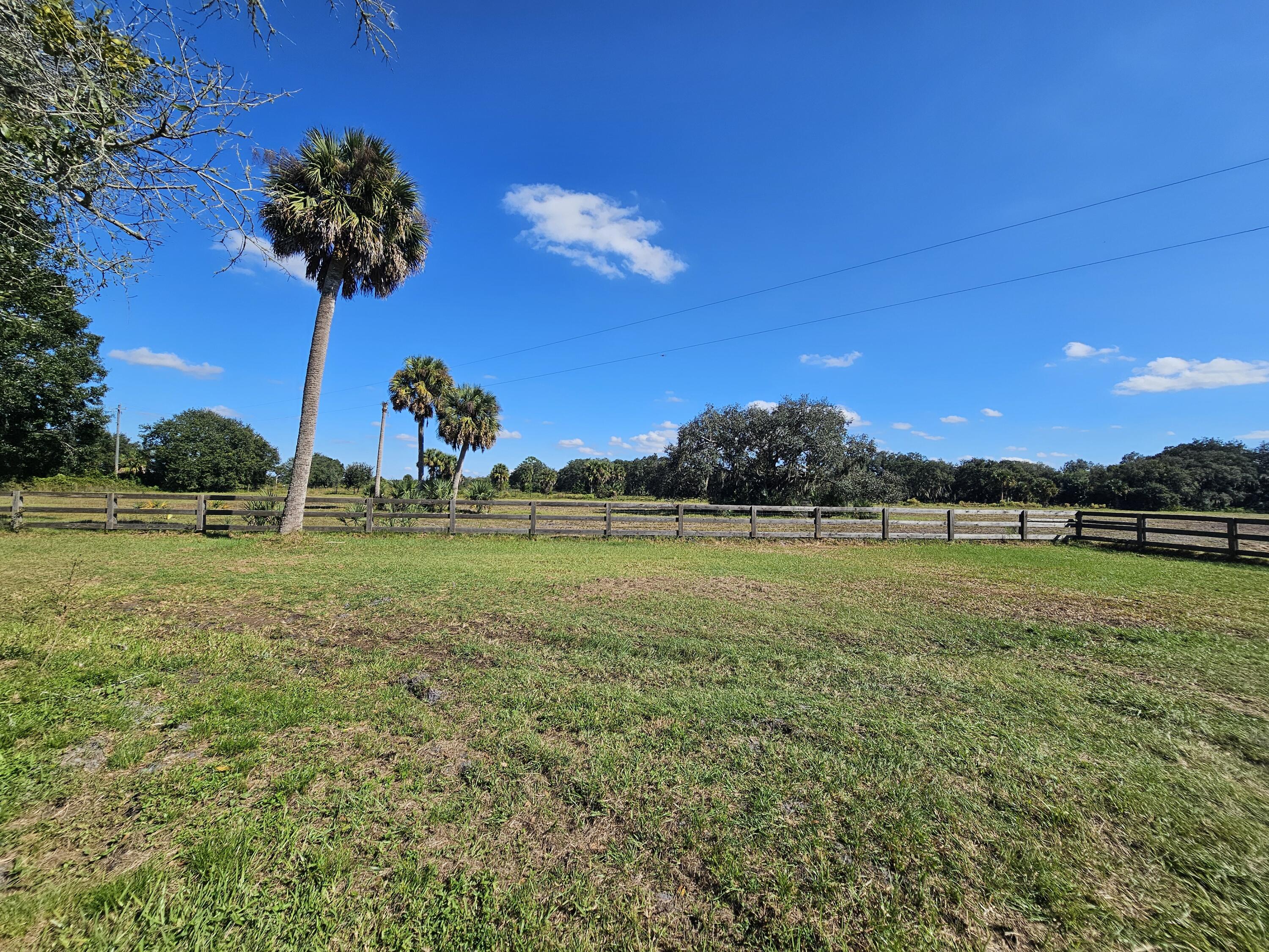 4900 Northwest 160th Street Okeechobee, FL 34972 - Photo 20 of 23 a view of a golf course with a lake