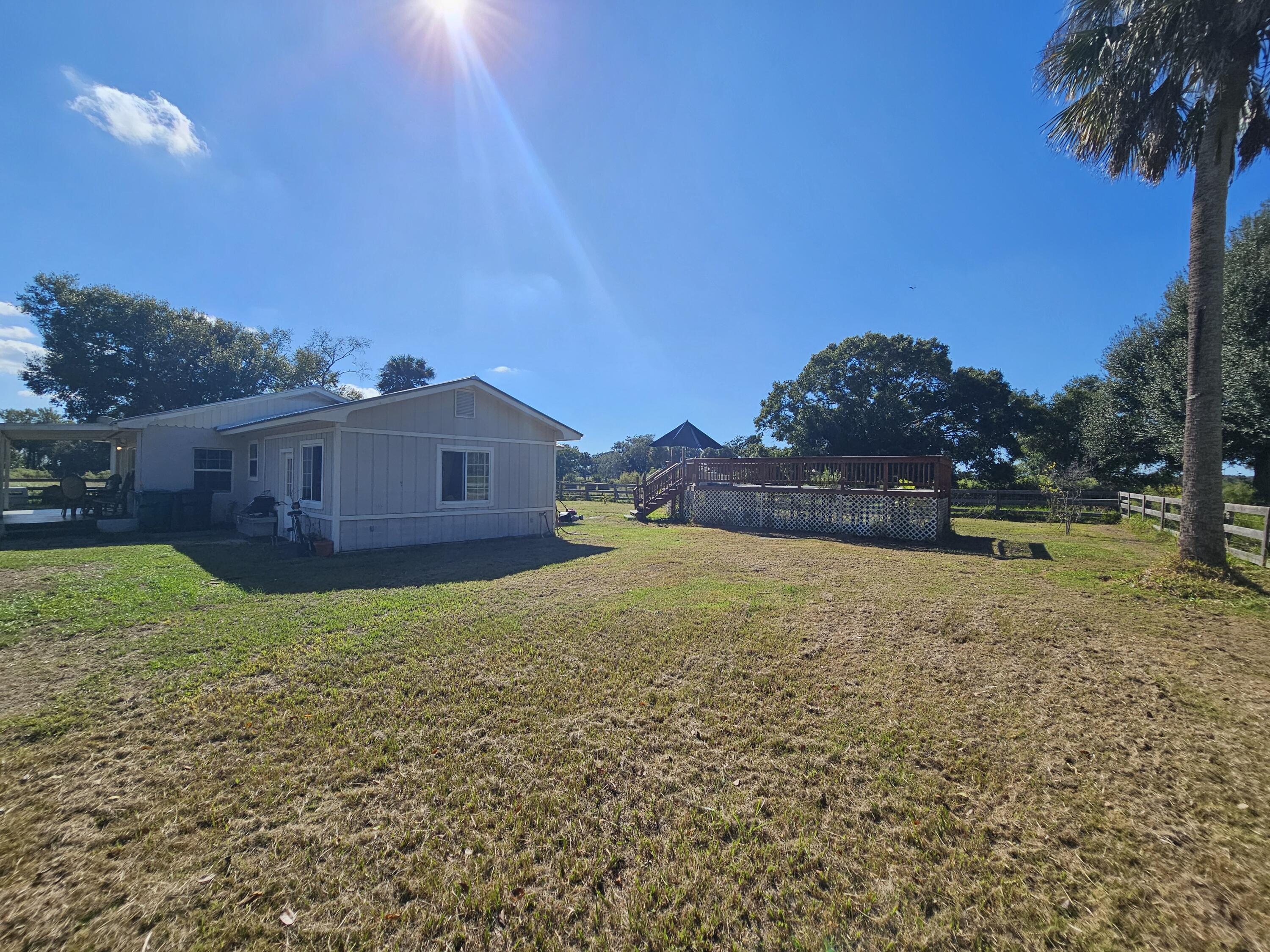4900 Northwest 160th Street Okeechobee, FL 34972 - Photo 4 of 23 a view of a house with a yard