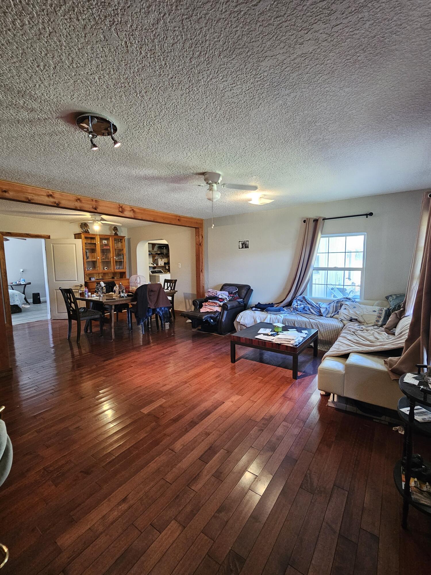 4900 Northwest 160th Street Okeechobee, FL 34972 - Photo 5 of 23 a living room with furniture and wooden floor