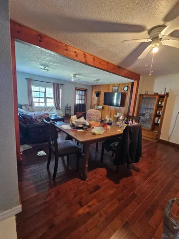 a outdoor dining space with furniture and wooden floor