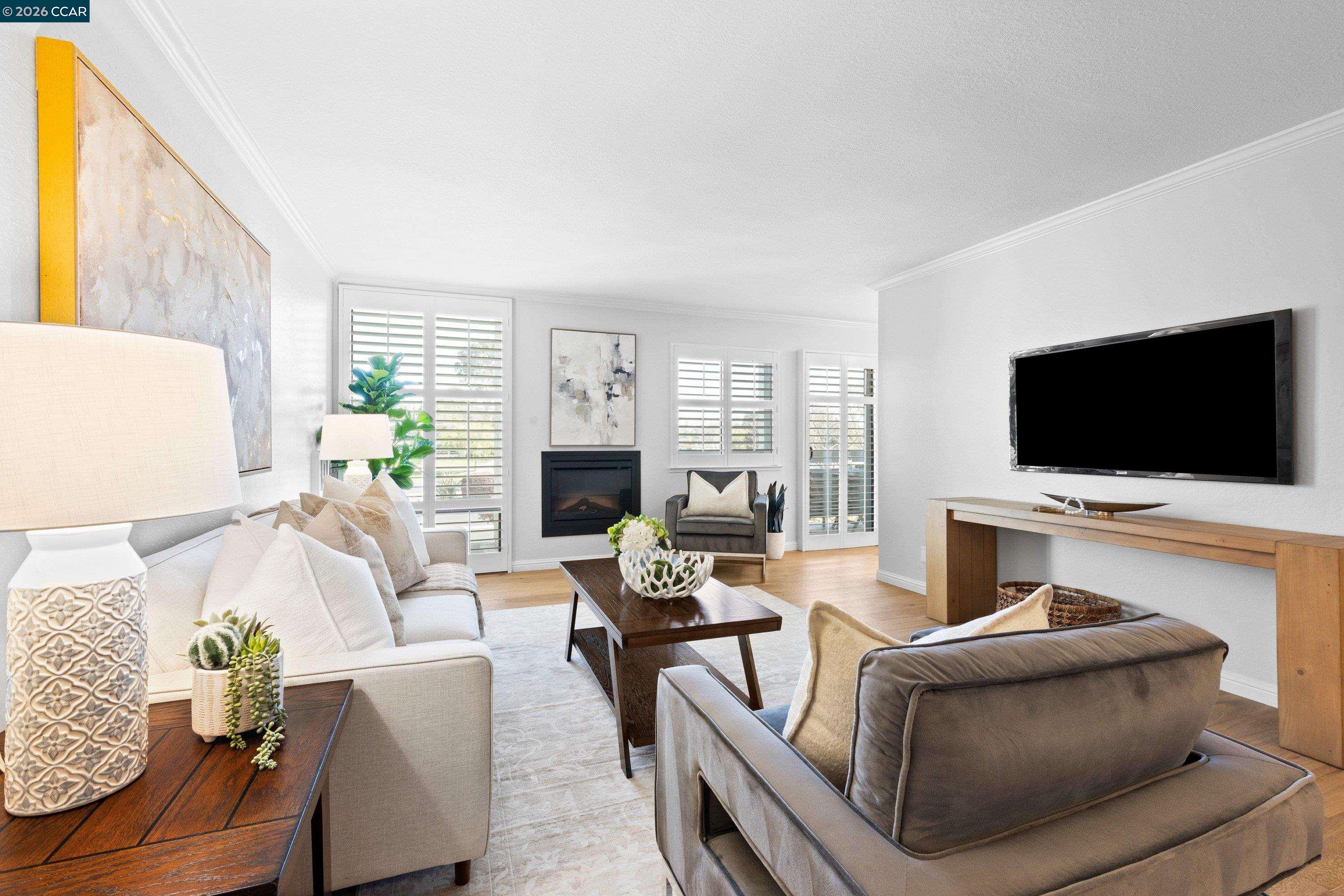 1111 Compass Lane, Unit 105 Foster City, CA 94404 - Photo 1 of 1 a living room with furniture and a flat screen tv