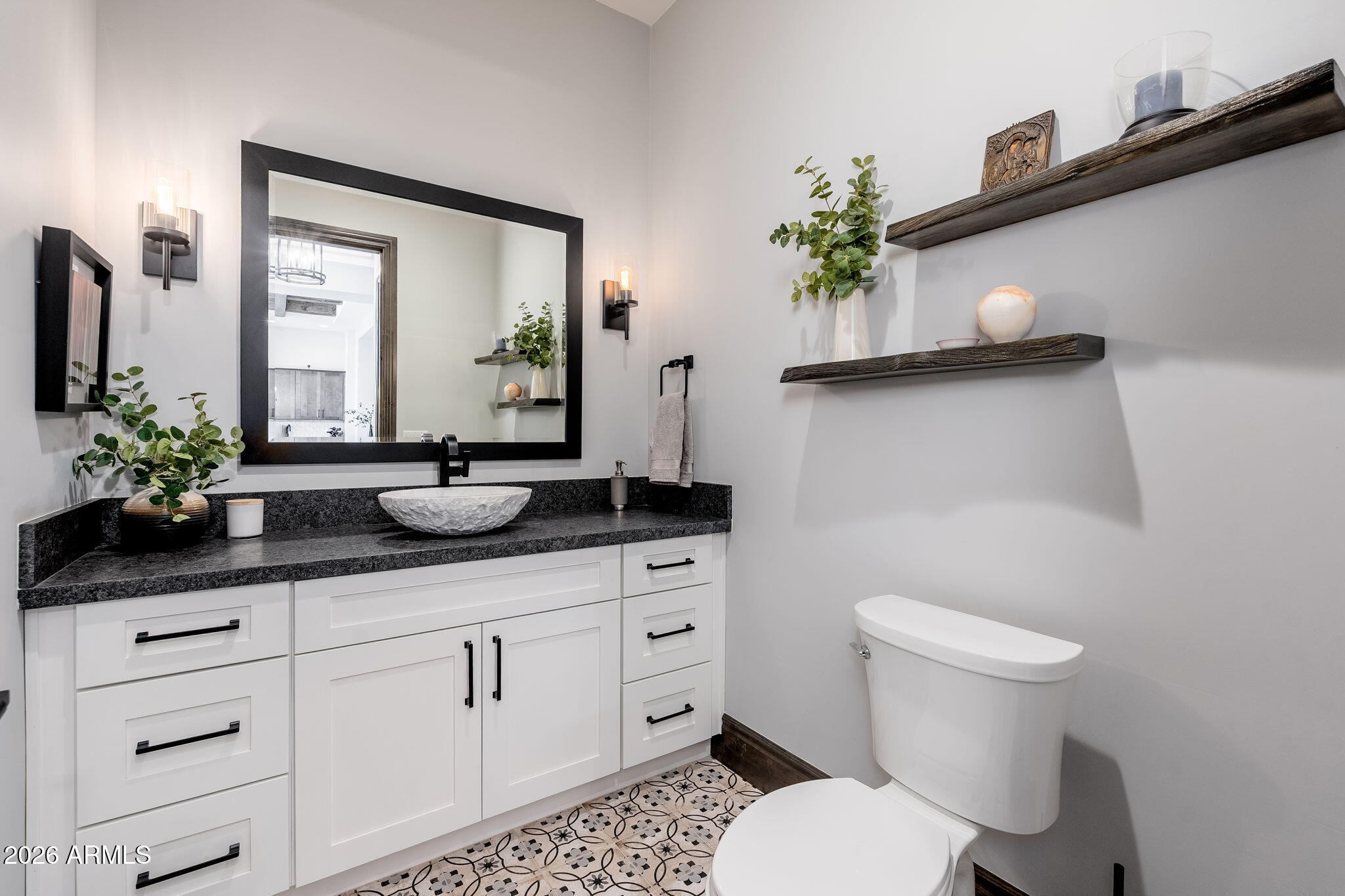 602 North Redbud Circle Payson, AZ 85541 - Photo 41 of 83 a bathroom with a toilet a sink and mirror
