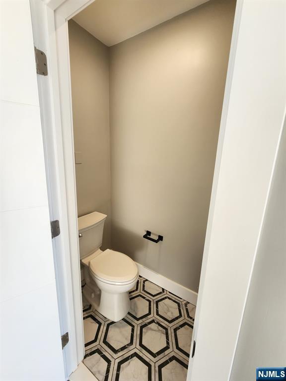 93 Hughes Street, Unit 4 Maplewood, NJ 07040 - Photo 16 of 20 a bathroom with a sink and a toilet