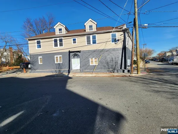 a front view of a house with yard