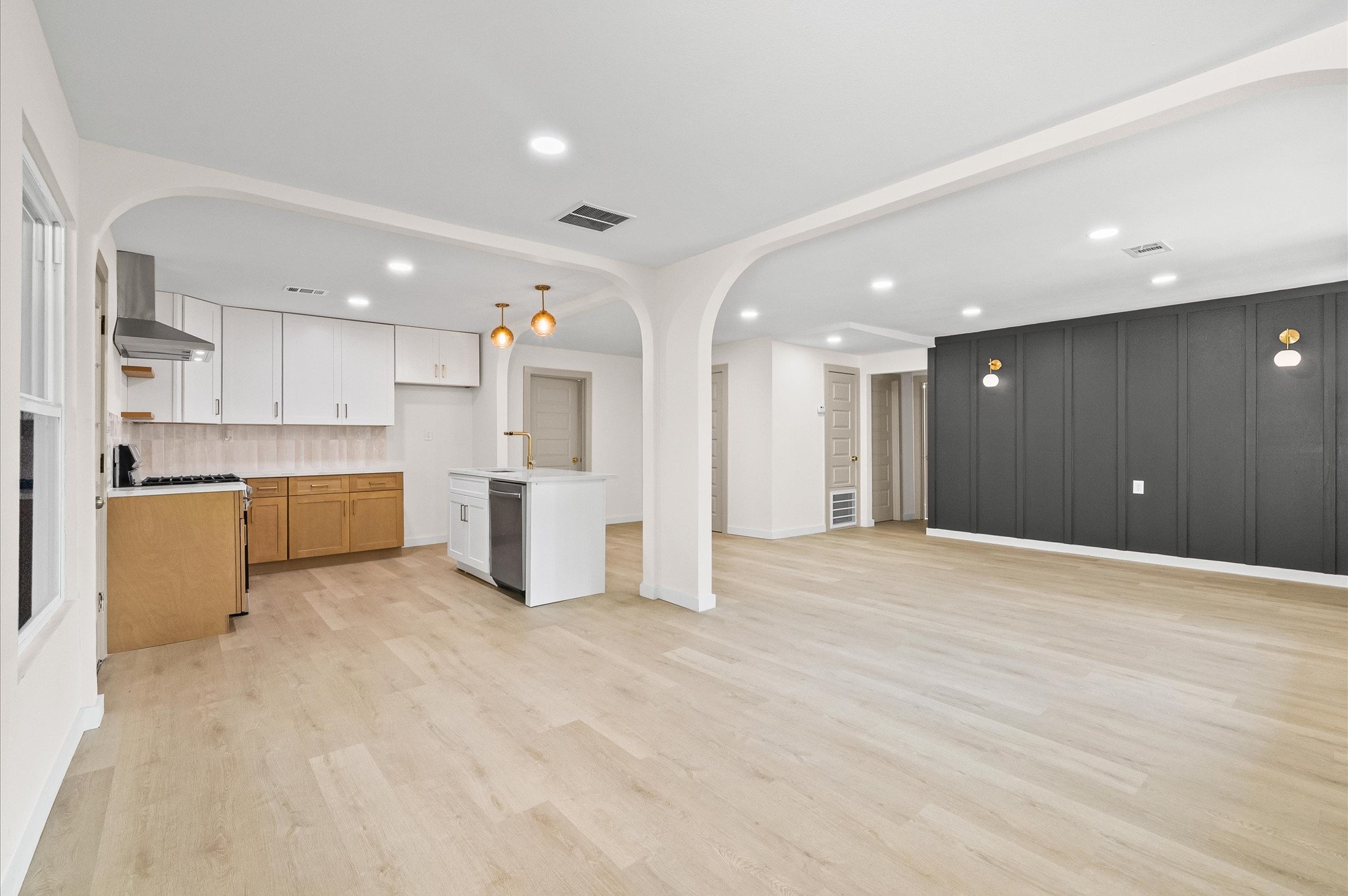 a view of a kitchen with a sink and cabinets