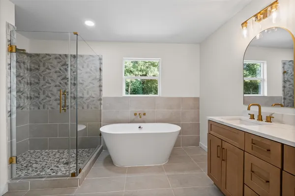 a bathroom with a bathtub and a sink