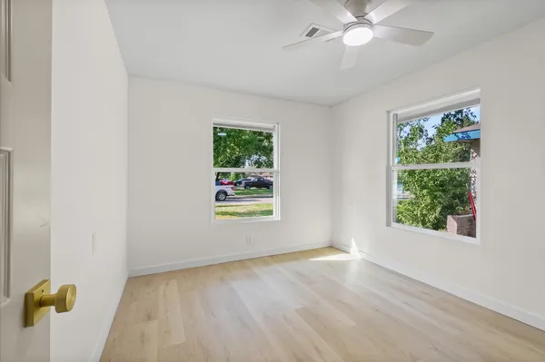 a view of an empty room with a window