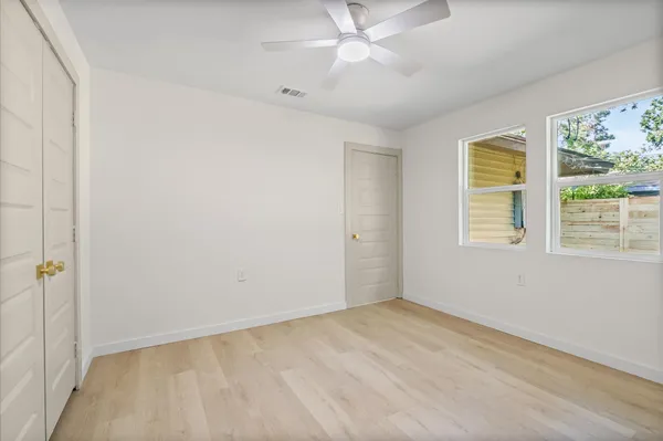 a view of an empty room with a window
