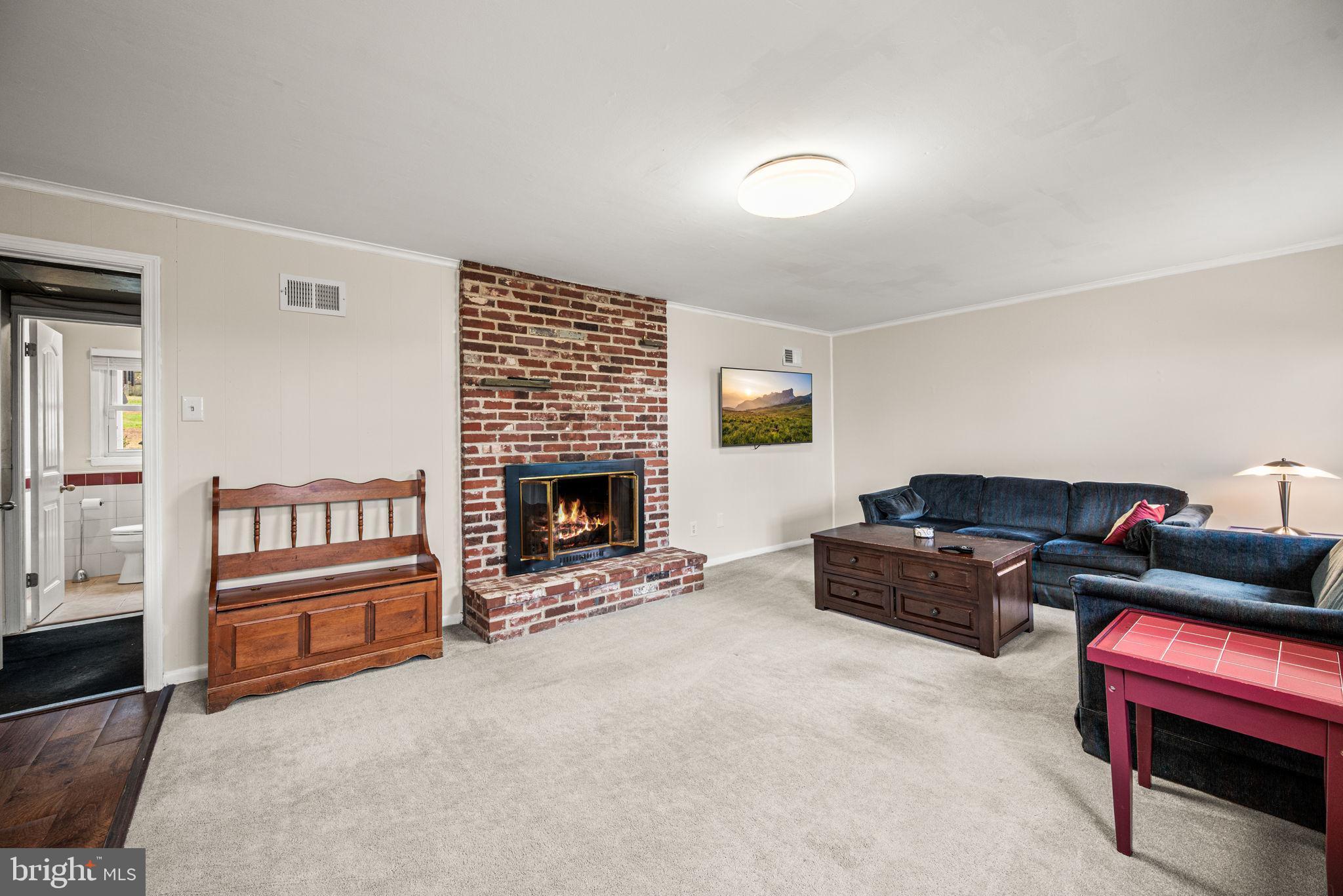 309 Saybrook Road Villanova, PA 19085 - Photo 17 of 47 a living room with furniture and a fireplace