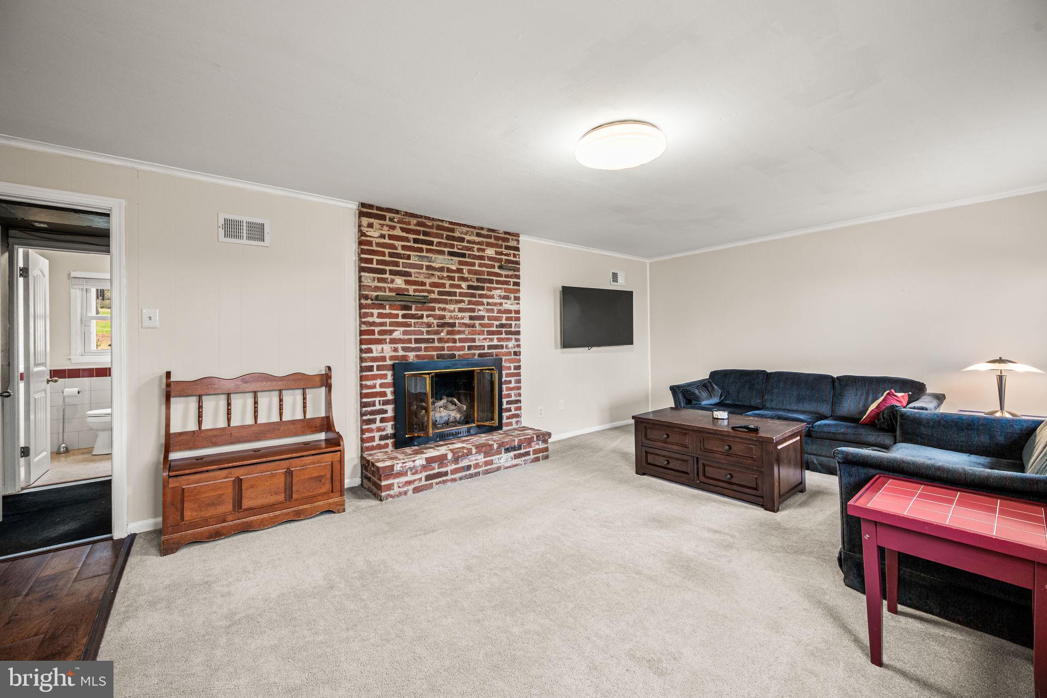 309 Saybrook Road Villanova, PA 19085 - Photo 18 of 47 a living room with furniture and a fireplace