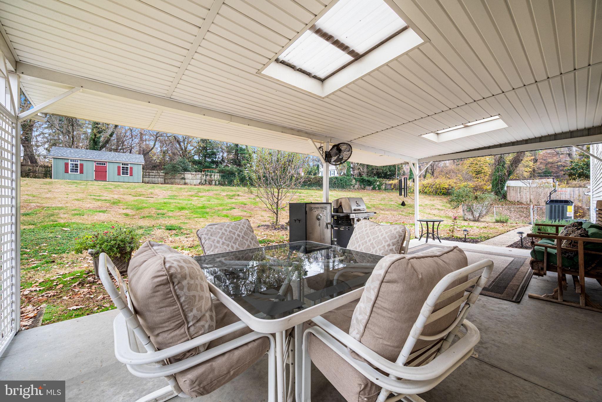 309 Saybrook Road Villanova, PA 19085 - Photo 32 of 47 a view of a patio with table and chairs potted plants with floor to ceiling window