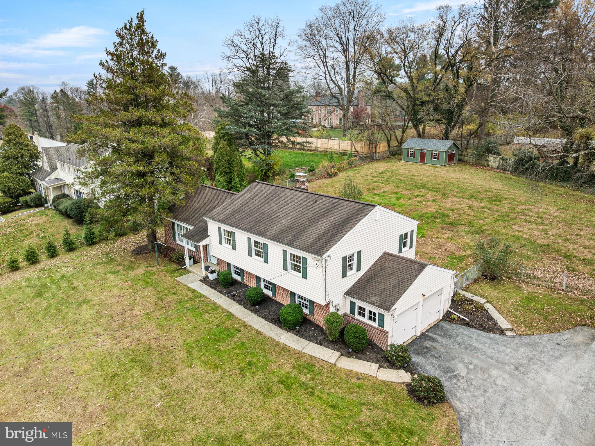 309 Saybrook Road Villanova, PA 19085 - Photo 37 of 47 a aerial view of a house with swimming pool and large trees
