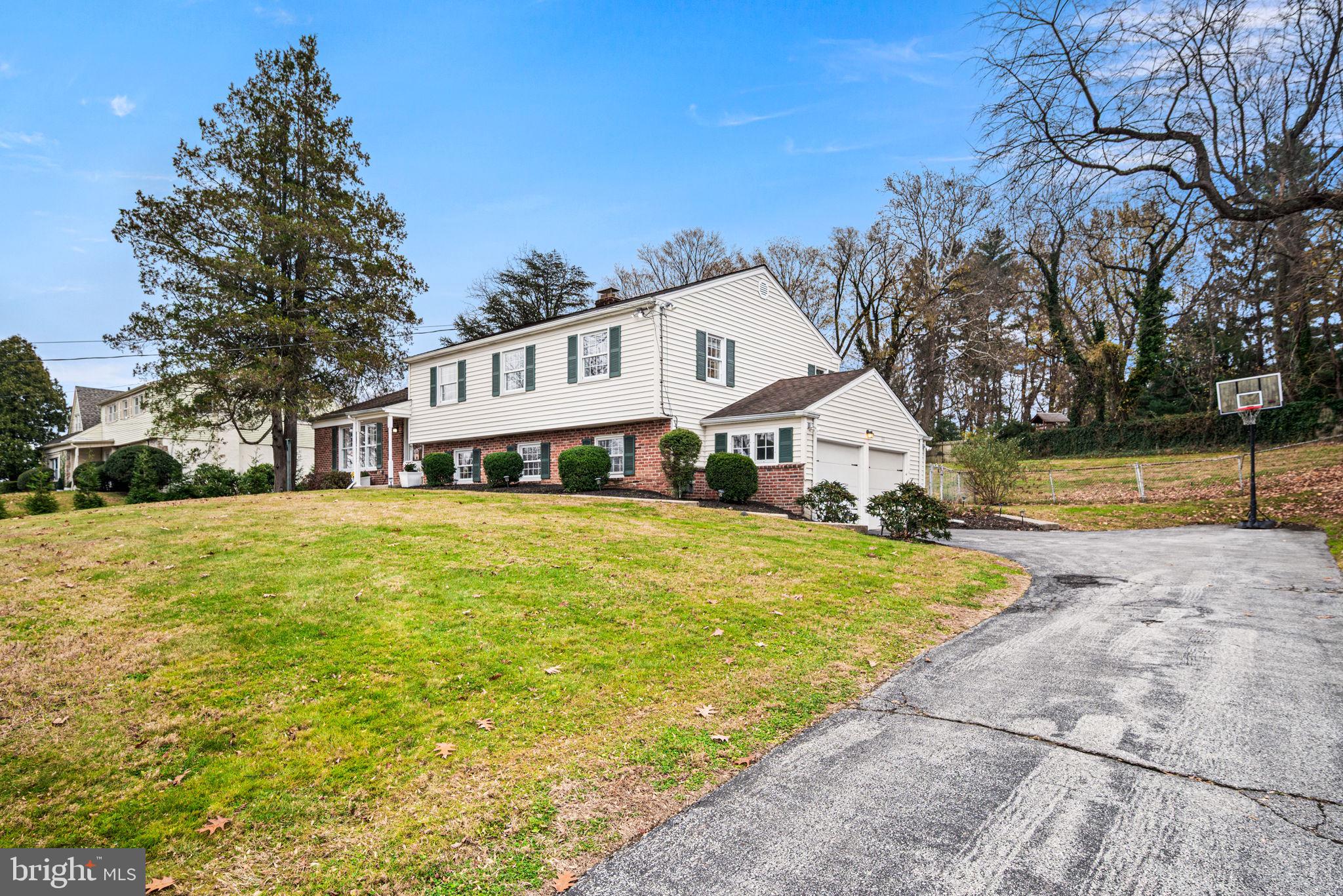 309 Saybrook Road Villanova, PA 19085 - Photo 38 of 47 a front view of a house with swimming pool and large trees