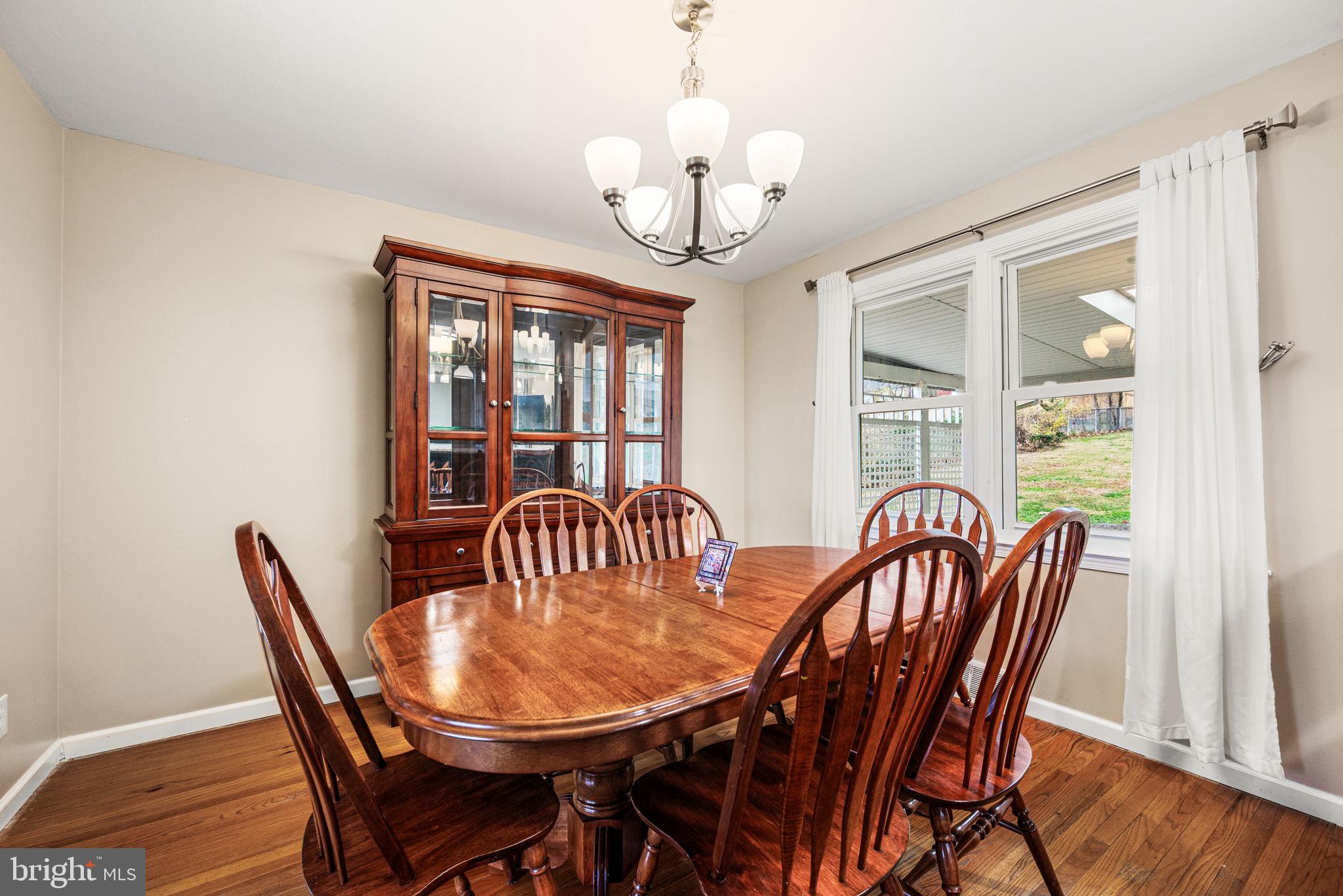 309 Saybrook Road Villanova, PA 19085 - Photo 8 of 47 a view of a dining room with furniture wooden floor and chandelier
