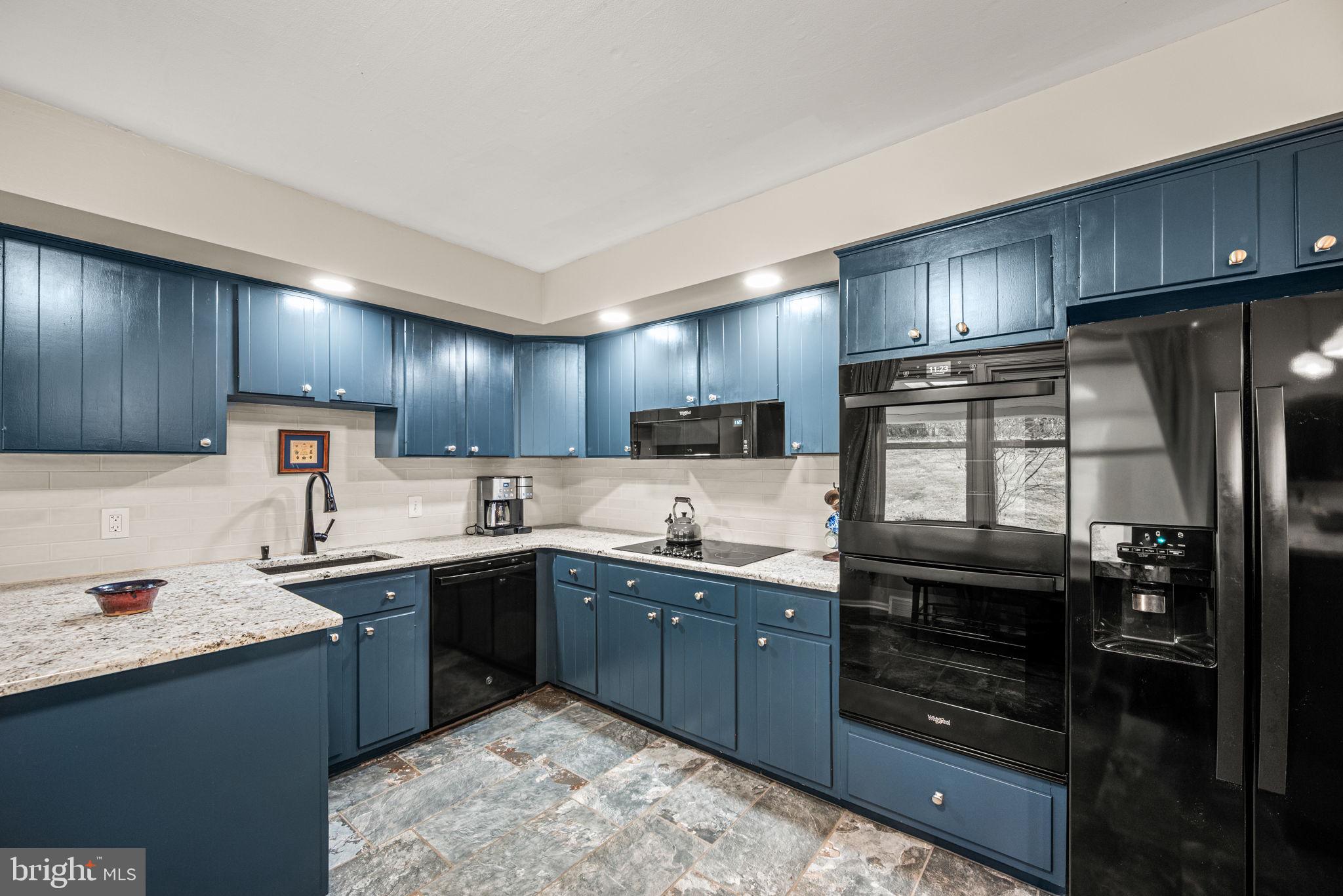 309 Saybrook Road Villanova, PA 19085 - Photo 10 of 47 a kitchen with lots of counter top space sink and refrigerator